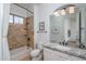 Beautiful bathroom featuring granite countertops, a shower-bathtub, tiled floors, and modern fixtures for a timeless look at 9612 W Mariposa Grande --, Peoria, AZ 85383