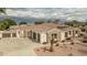 Single-story home featuring a three-car garage, stone accents, and a tile roof at 9612 W Mariposa Grande --, Peoria, AZ 85383