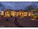 Charming single-story home featuring a stone facade, manicured desert landscaping, and a welcoming entrance at 9612 W Mariposa Grande --, Peoria, AZ 85383