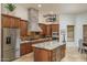 Beautiful kitchen with an island, stainless steel appliances, and elegant stone accents for cooking at 9612 W Mariposa Grande --, Peoria, AZ 85383