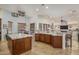 Gourmet kitchen featuring a large island, granite countertops, and stainless steel appliances at 9612 W Mariposa Grande --, Peoria, AZ 85383