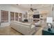 Inviting living room with high ceilings, natural light, a cozy fireplace, and stylish decor at 9612 W Mariposa Grande --, Peoria, AZ 85383