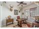 Well-appointed home office with a classic wooden desk, decorative art, and ample natural light at 9612 W Mariposa Grande --, Peoria, AZ 85383