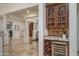 Convenient wet bar with a wine fridge and granite countertops is ideal for entertaining and enjoyment at 9612 W Mariposa Grande --, Peoria, AZ 85383