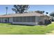 A nice desert home with a large screened in patio and large grassy backyard at 9814 W Shasta Dr, Sun City, AZ 85351