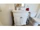 Bathroom featuring a white vanity with a unique mirror, with a toilet nearby at 9814 W Shasta Dr, Sun City, AZ 85351
