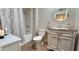Clean bathroom with a shower-tub combo, neutral walls, decorative mirror, and sink with vanity at 9814 W Shasta Dr, Sun City, AZ 85351