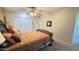 Comfortable bedroom boasts a plush bed, soft lighting, and ample closet space at 9814 W Shasta Dr, Sun City, AZ 85351