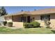 Inviting ranch-style home with covered entry, landscaped garden, and charming brick accents at 9814 W Shasta Dr, Sun City, AZ 85351