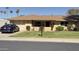 Charming single-story home with a well-maintained lawn, desert landscaping, and attached two-car garage at 9814 W Shasta Dr, Sun City, AZ 85351