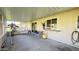 Enclosed patio with a bench and plenty of space at 9814 W Shasta Dr, Sun City, AZ 85351