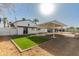 Open backyard featuring a covered structure and well manicured artifical lawn at 1006 E Weber Dr, Tempe, AZ 85288