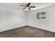 Empty bedroom featuring wood-look floors, white walls, a window, and a ceiling fan at 1006 E Weber Dr, Tempe, AZ 85288