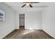 Bedroom featuring a ceiling fan, a large window, and spacious closet at 1006 E Weber Dr, Tempe, AZ 85288