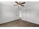 Bedroom features wood-look floors, a window, a ceiling fan, and closet at 1006 E Weber Dr, Tempe, AZ 85288