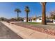 Charming single-story home featuring well-manicured landscaping and inviting curb appeal with mature trees at 1006 E Weber Dr, Tempe, AZ 85288