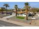 Inviting single-Gathering home with desert landscaping, lush artificial turf, and mature palms offers great curb appeal at 1006 E Weber Dr, Tempe, AZ 85288