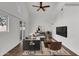 Staged living room with large windows, ceiling fan and plenty of natural light at 1006 E Weber Dr, Tempe, AZ 85288