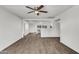 Bright and airy living room with luxury vinyl plank flooring, fresh paint, and a ceiling fan at 1006 E Weber Dr, Tempe, AZ 85288