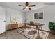 Home office area with modern desk, storage cabinet, and natural light from window at 1006 E Weber Dr, Tempe, AZ 85288