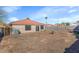 The backyard features a patio area, block fence, and potential for landscaping to create a private outdoor oasis at 10461 E Birchwood Ave, Mesa, AZ 85208