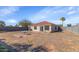 View of the backyard with a covered patio and block wall at 10461 E Birchwood Ave, Mesa, AZ 85208