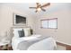 Cozy bedroom featuring a comfortable bed, soft lighting, and a window, creating a tranquil retreat at 10461 E Birchwood Ave, Mesa, AZ 85208