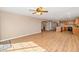 Open-concept living room featuring sleek wood floors and neutral paint, blending elegance with modern design at 10461 E Birchwood Ave, Mesa, AZ 85208