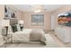 Relaxing main bedroom with plush carpet, a ceiling fan, and a large window, creating a serene retreat at 10461 E Birchwood Ave, Mesa, AZ 85208