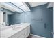 Bathroom with large vanity and well-lit mirror at 107 Leisure World --, Mesa, AZ 85206