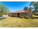 Charming single-story home with mature landscaping, inviting entry and tan exterior paint at 107 Leisure World --, Mesa, AZ 85206