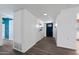 Hallway with sleek flooring, clean lines, and a contemporary door adding modern sophistication at 107 Leisure World --, Mesa, AZ 85206