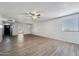 Comfortable living area with refined floors, fan, and a clear view into the remodeled kitchen at 107 Leisure World --, Mesa, AZ 85206