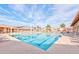 Wide view of a large pool with shade structures and lounge chairs at 107 Leisure World --, Mesa, AZ 85206