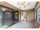 Cozy sunroom featuring tile floors, a ceiling fan, and access to an outdoor patio at 107 Leisure World --, Mesa, AZ 85206