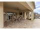 Covered patio with tile flooring, ceiling fan and dining table and chairs at 11721 W Parkway Ln, Avondale, AZ 85323