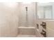 Shower with neutral tiles, a bench, and a dual shower head at 11721 W Parkway Ln, Avondale, AZ 85323