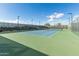 Enjoy playing tennis on this well-maintained court surrounded by a tall fence at 11721 W Parkway Ln, Avondale, AZ 85323