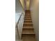 Staircase with tile steps, dark trim and white handrail leading up at 1215 E Lemon St # 212, Tempe, AZ 85281