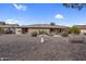 Backyard featuring cacti, various desert plants, a birdbath, and low-maintenance gravel at 13235 W Ashwood Dr, Sun City West, AZ 85375