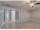 Spacious bedroom featuring wood-look flooring and an ensuite bathroom at 13235 W Ashwood Dr, Sun City West, AZ 85375