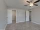 Spacious bedroom features wood-look flooring, neutral walls, and closet doors on either side at 13235 W Ashwood Dr, Sun City West, AZ 85375