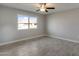 Bedroom featuring neutral walls, wood-look flooring, and a window with a view of the neighborhood at 13235 W Ashwood Dr, Sun City West, AZ 85375