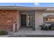 Covered entryway featuring a secure screen door and decorative posts adds curb appeal to this home at 13235 W Ashwood Dr, Sun City West, AZ 85375