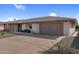 This home features a desert landscaped front yard and a two-car garage with a long driveway at 13235 W Ashwood Dr, Sun City West, AZ 85375