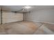 Spacious garage with an automatic door and a concrete floor at 13235 W Ashwood Dr, Sun City West, AZ 85375