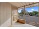 Cozy covered patio featuring a screened door and offering a view of the low maintenance yard at 13235 W Ashwood Dr, Sun City West, AZ 85375