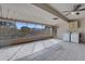 Bright sunroom with ceiling fan, tile flooring, and a washer and dryer hook-up at 13235 W Ashwood Dr, Sun City West, AZ 85375