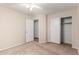 Bedroom with carpeted floor, fan, and closet at 1339 E Silverbrush Trl, Casa Grande, AZ 85122