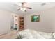 Bedroom featuring a ceiling fan and en-suite bathroom at 1339 E Silverbrush Trl, Casa Grande, AZ 85122